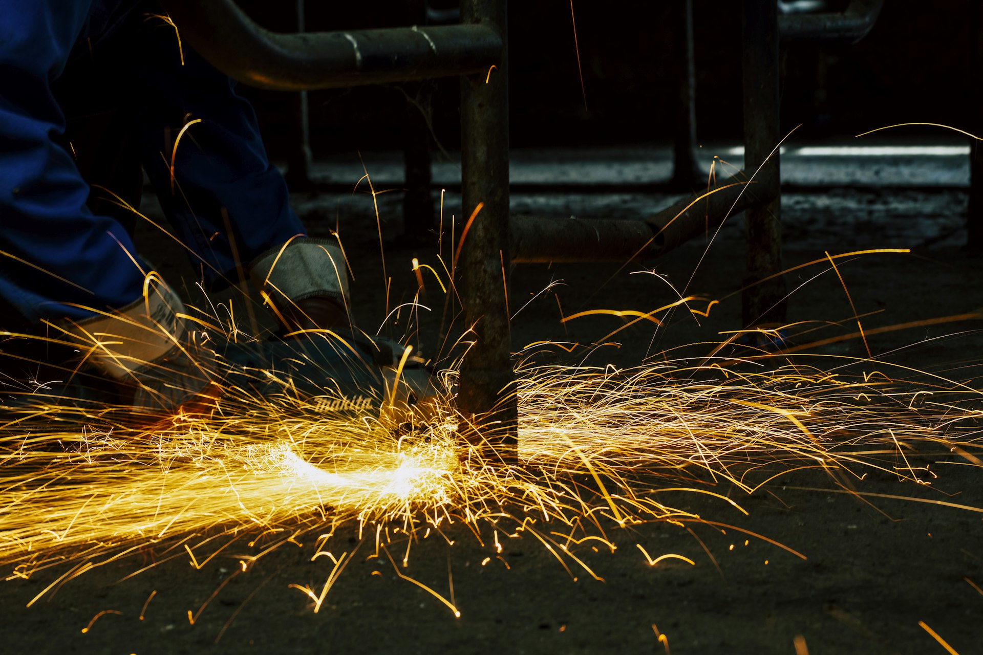 American manufacturing floor with sparks from metal fabrication